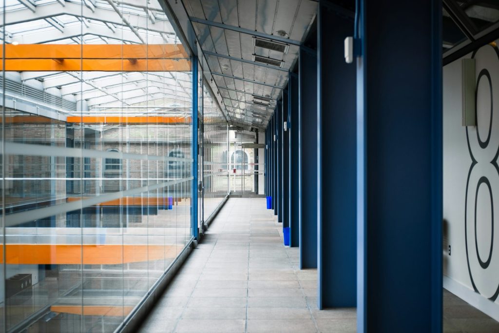 A modern building interior with long hallway.
