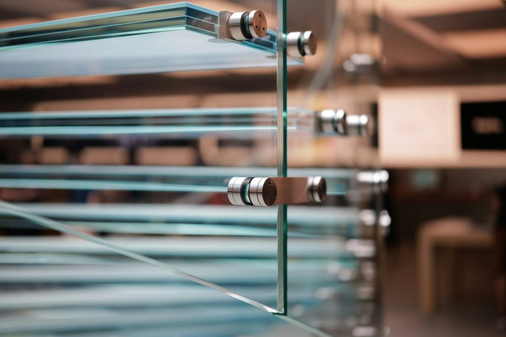 A close up of a glass window with a blurry background