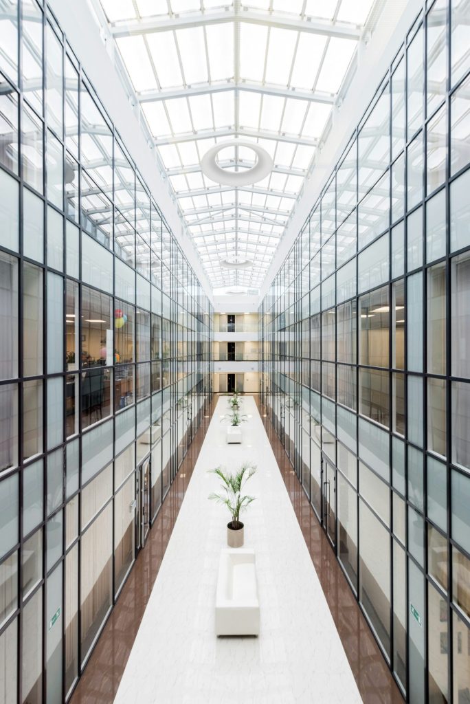 photography of glass wall hallway